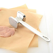 Two-sided meat hammer for tenderizing beef effectively.