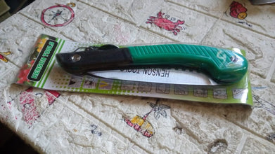 Folding saw for tree trimming and various cutting tasks, ideal for camping and gardening.