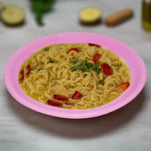 Round mini soup plates arranged on a surface.